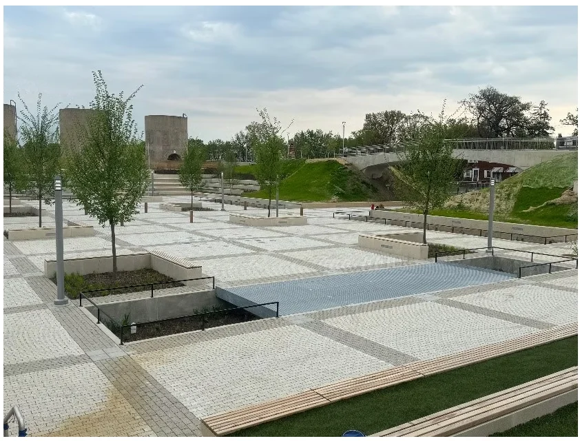 McMillan Community Center — completed plaza with patterned paving, cone towers, and integrated landscape features.