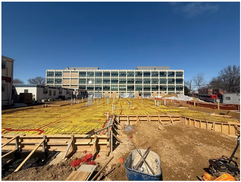 Leckie Elementary School — dense rebar mat and formwork prepared for structural slab placement.
